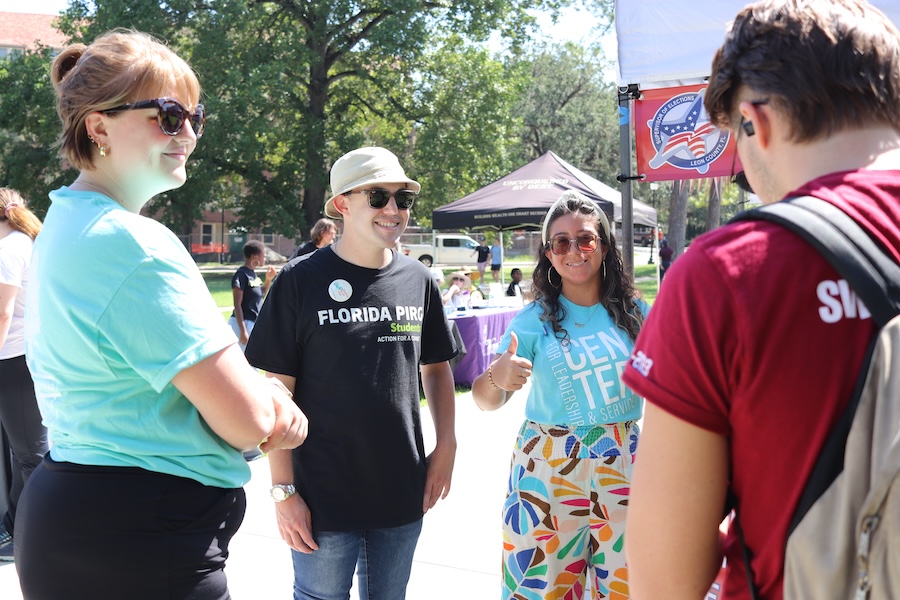 Samuel Appel, along with FSU Votes Coalition organizers Liz Iaconis and Jesmel Moreno, engage with students during a civic engagement event hosted on Landis Green.