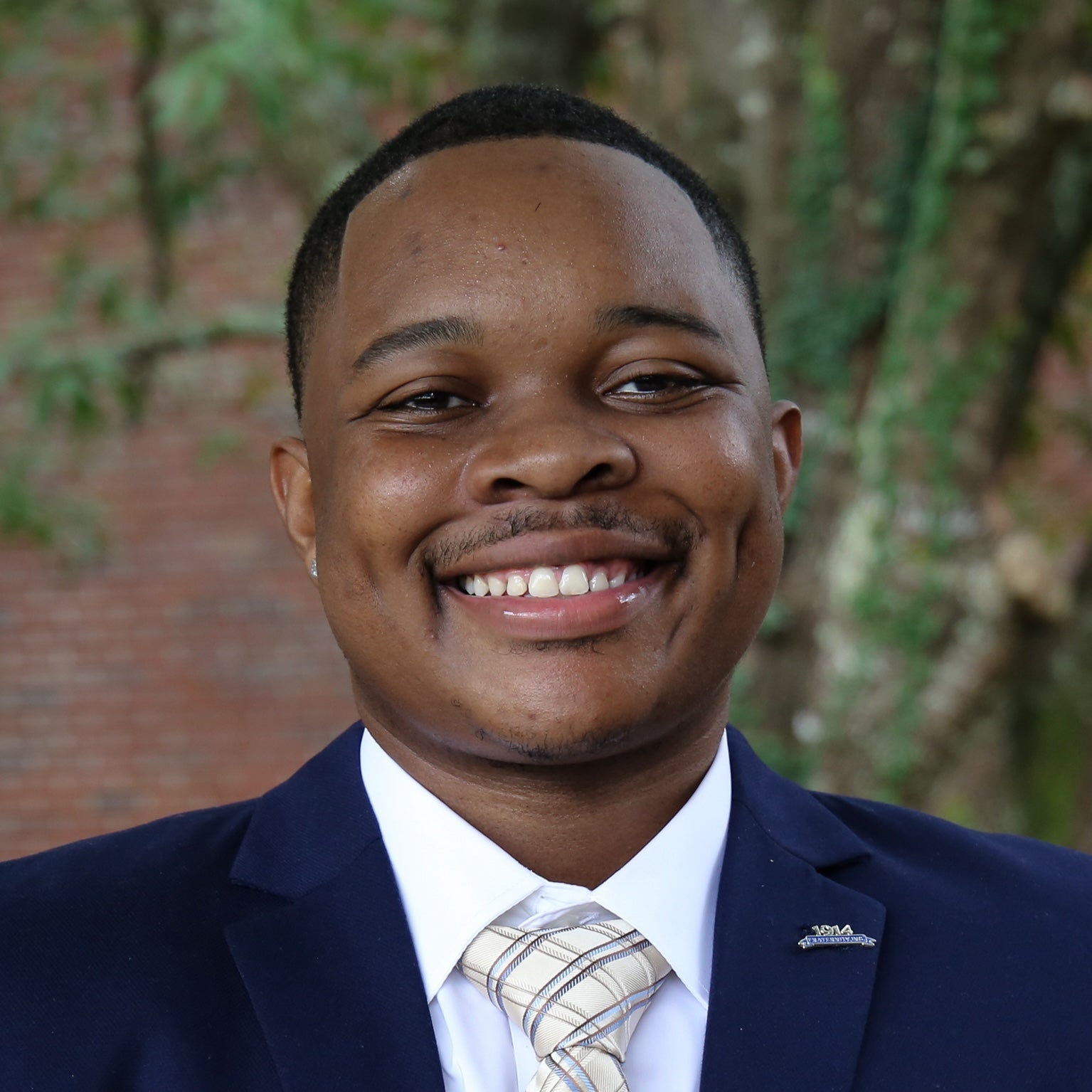 "Headshot of Johnnie Allen Jr in business attire"