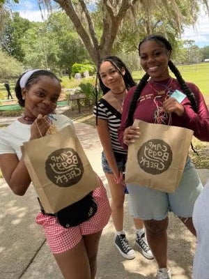 Students posing at Camp Boggy Creek.
