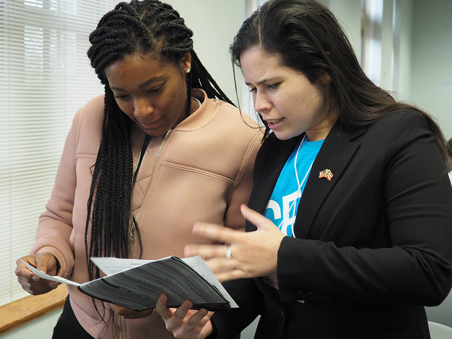 Students discuss a topic on which they have differing opinions in an activity during a featured presentation on tribalism.
