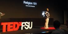 Kai Daniels on the TEDxFSU stage speaks about religion as member of the LGBTQ community.