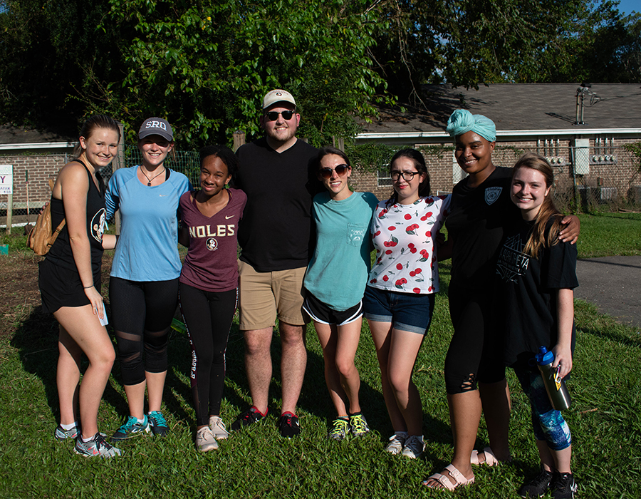 EngageTLH volunteers and facilitators are all smiles after removing weeds from the Damayan Community Garden.