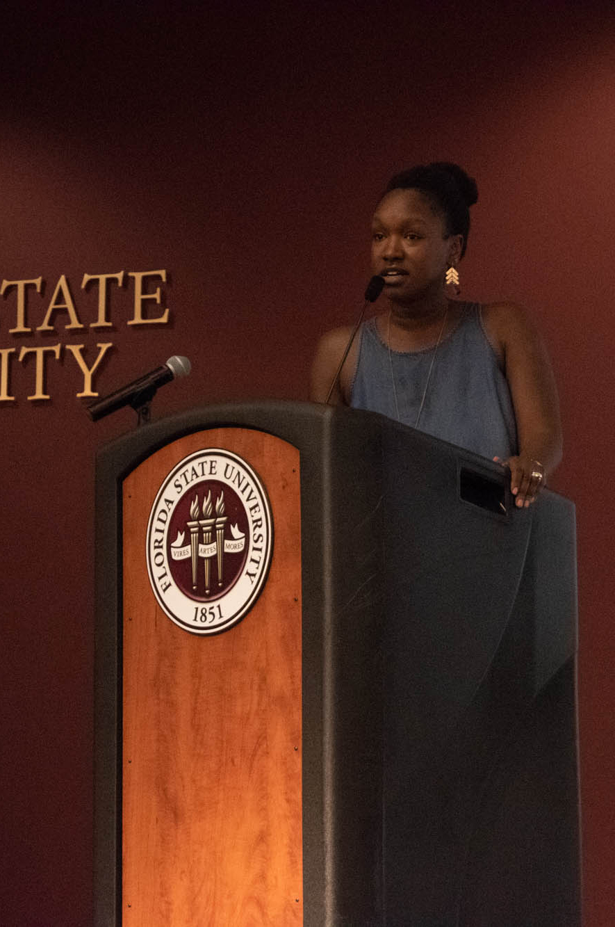 Keynote speaker Joviah Woodrich addresses attendees and mentors at the annual PeaceJam Slam.