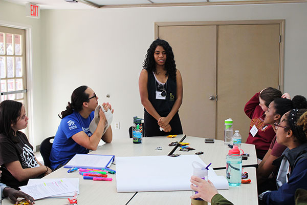 Participant Asia Warren introduces herself to her small group at Leadership<br />LOGIC