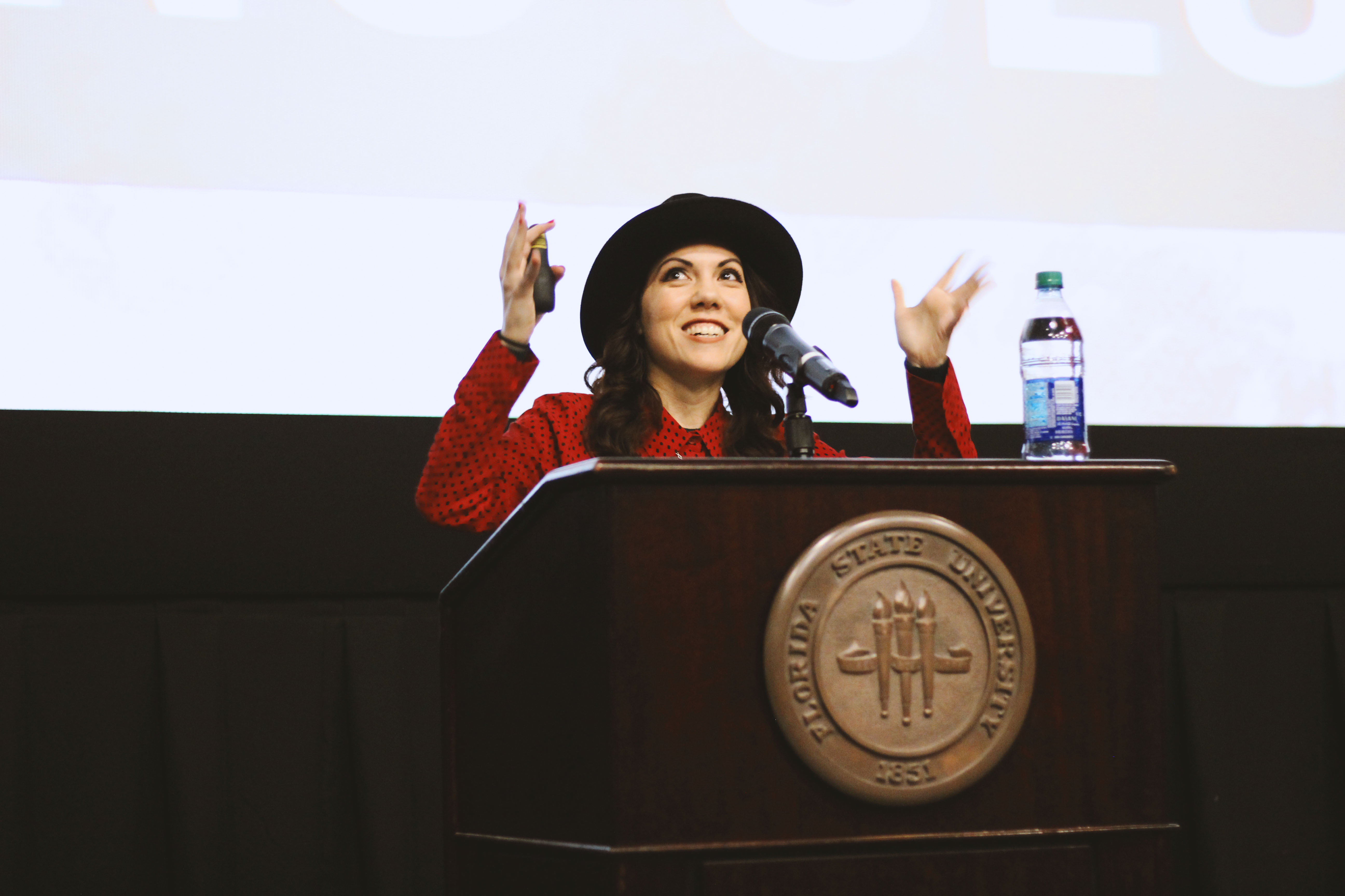 Jenny Lorenzo addresses the Multicultural Leadership Summit in Saturday's keynote address, speaking on what it means to live in the hyphen and the importance of telling our own stories.