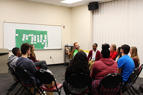 Multicultural Leadership Summit participants talk about what they've learned during a small group session on Friday.