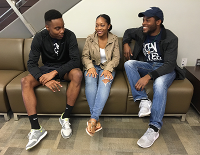 Social Change Peer Educators Chris Turner, Aniqua Hendricks and Brian Menard talk at an event to celebrate the program's launch.