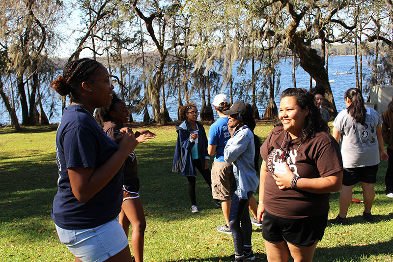 LOGIC participants engaging in conversation in the outdoors.