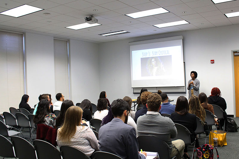 MLS participants observing a presentation given by a student presenter