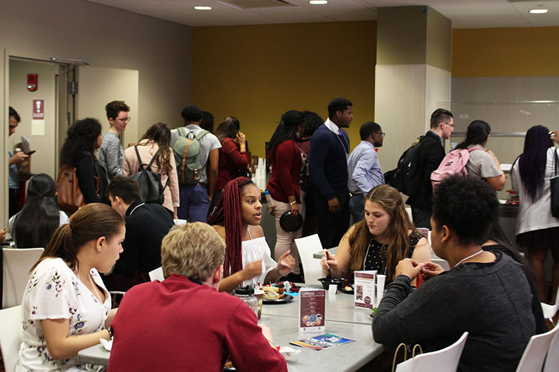 MLS participants socializing during lunch time