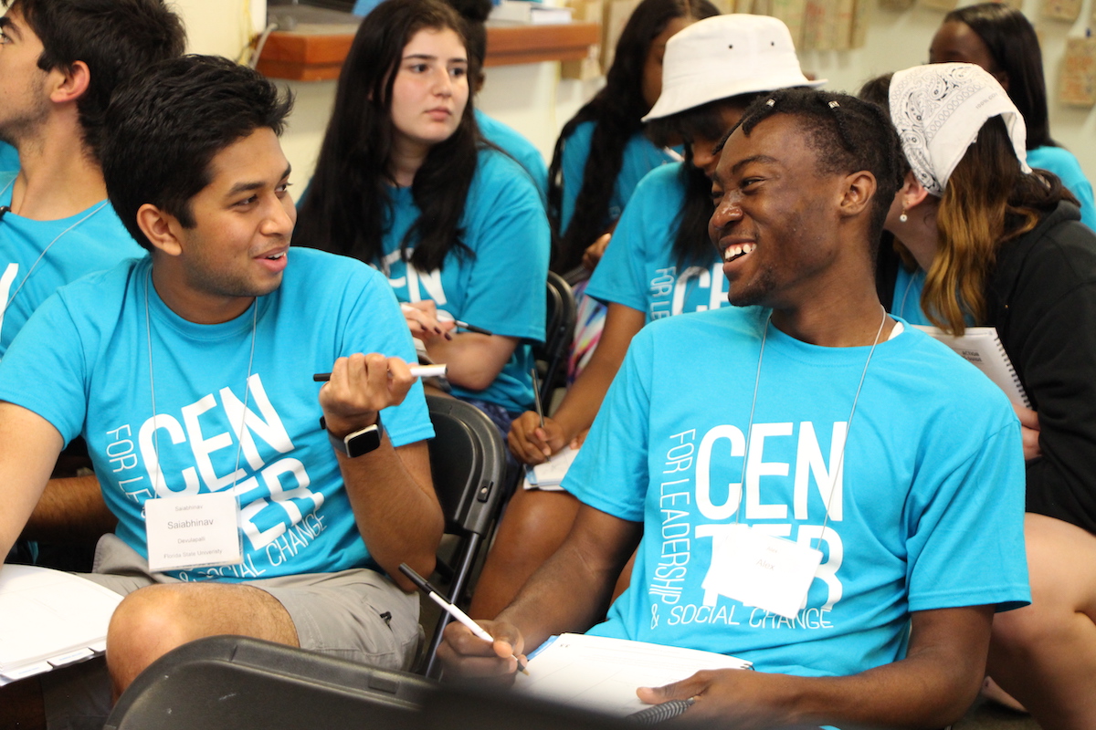 "Two students laugh during an activity at Leadershape"