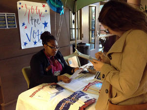 Desirae Brown helps students attending the 2016 Multicultural Leadership Summit register to vote during their lunch break.